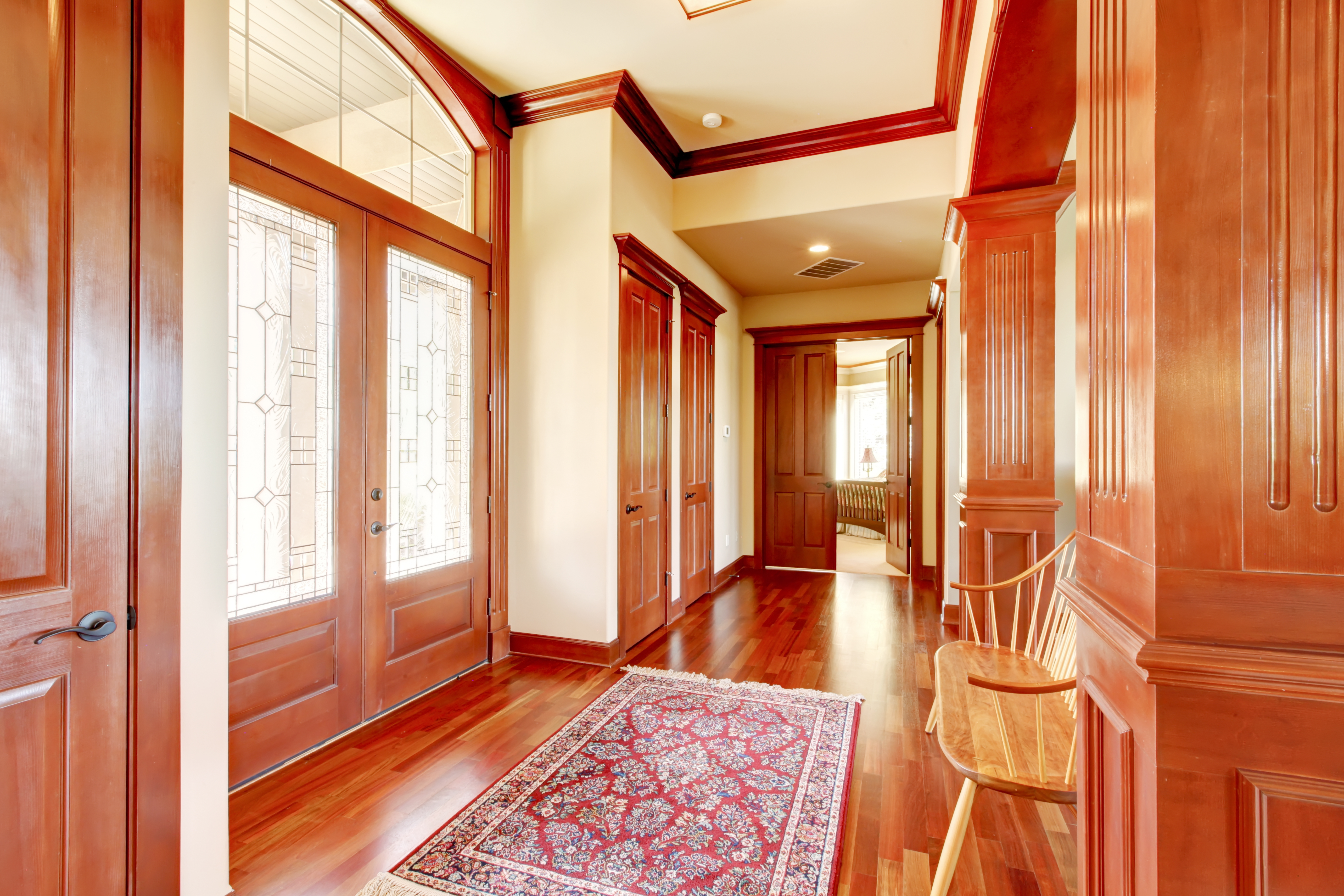 Wood crown molding installed in a luxury home foyer