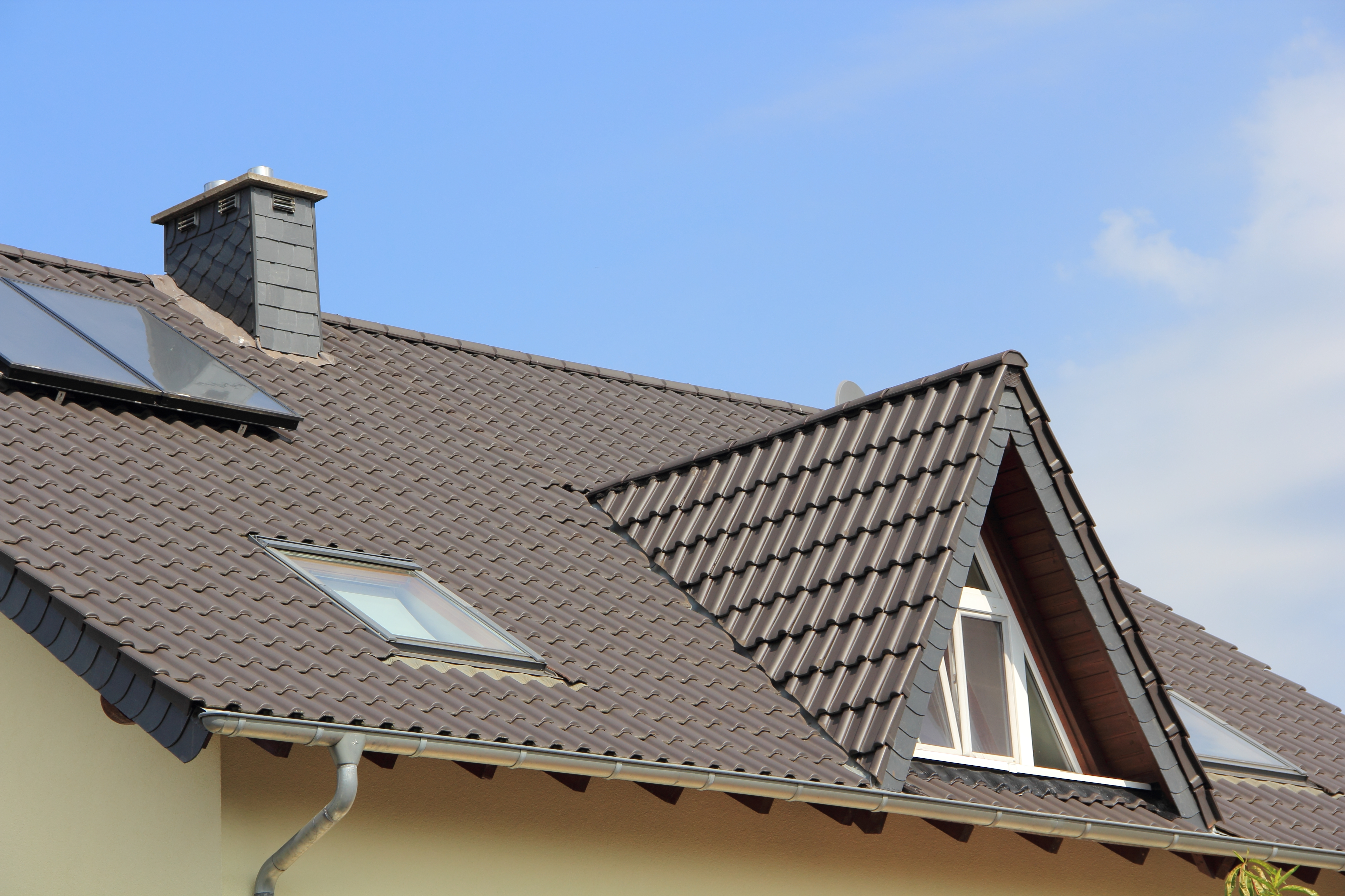 Dormer window and skylights on a metal roof