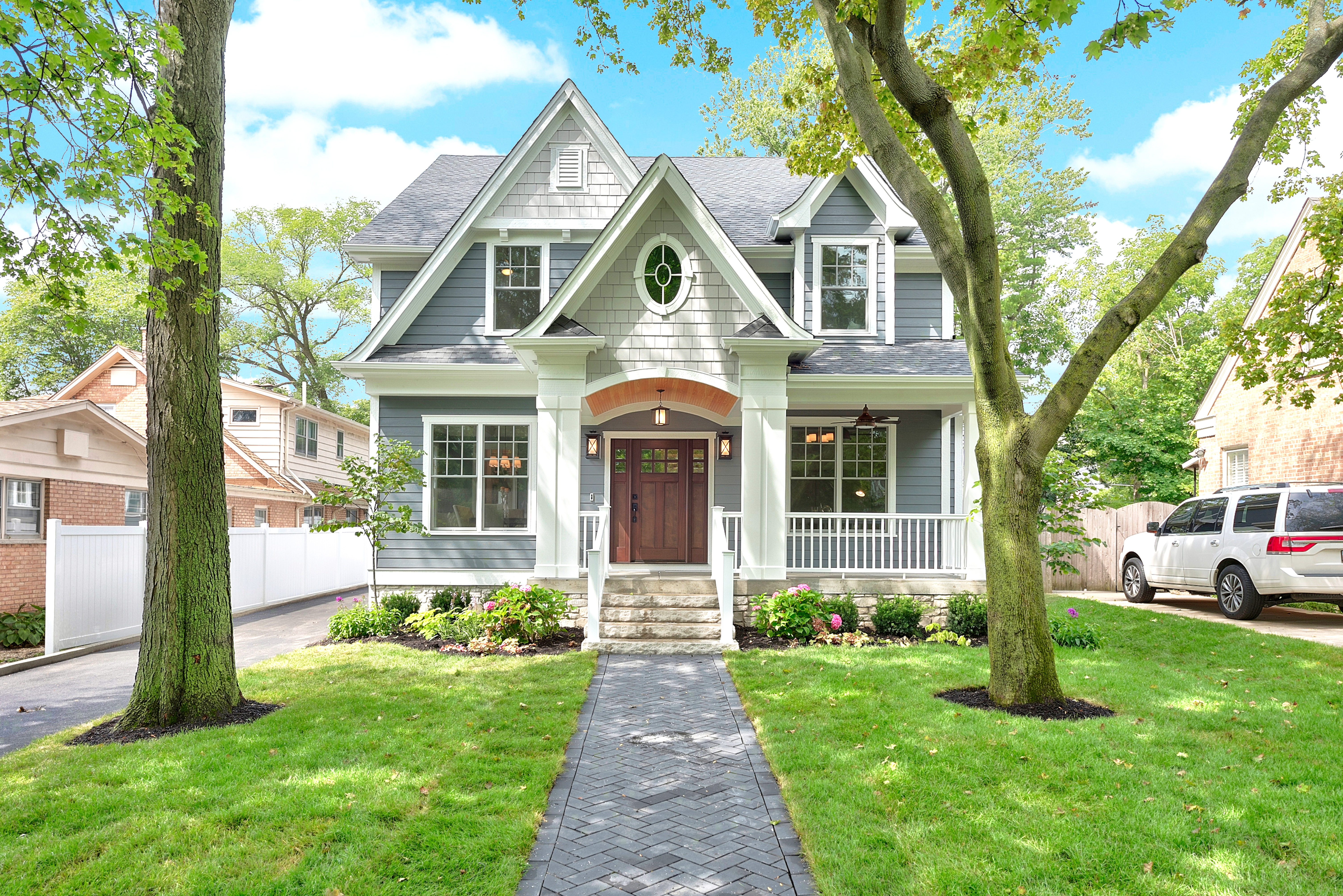 Two-story single-family home with new vinyl siding