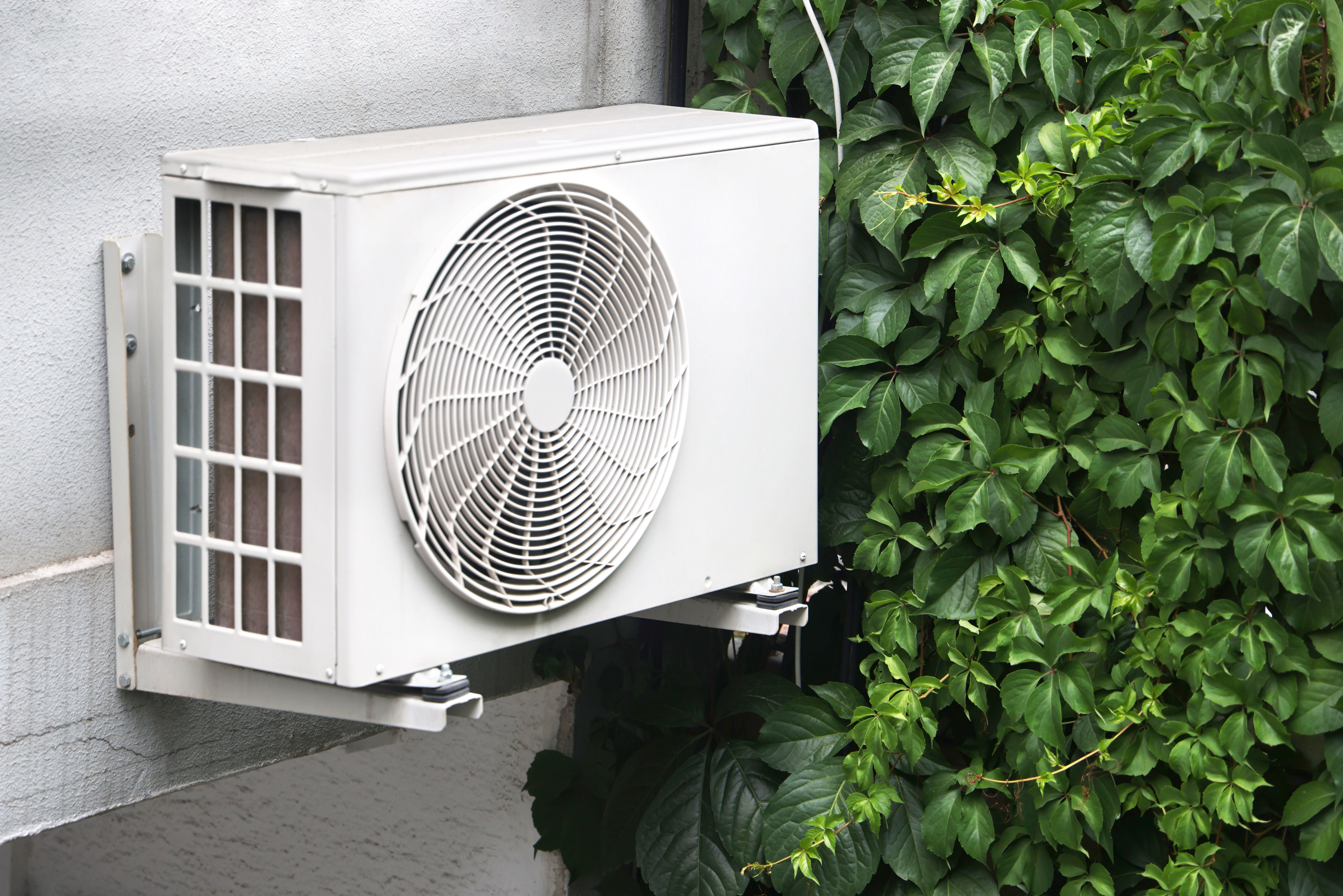 Air source heat pump installed outside of the house