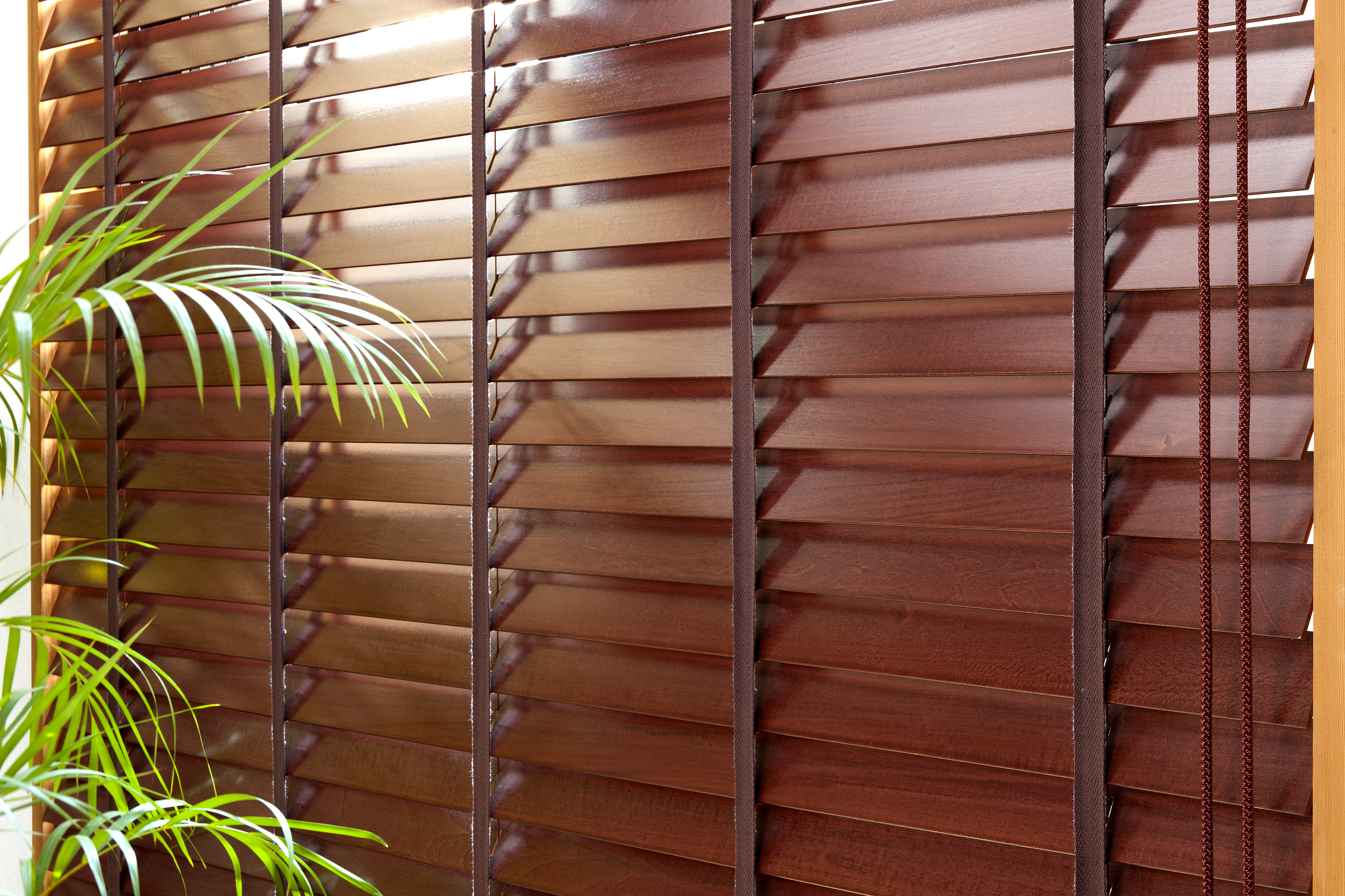 Wood window blinds installed in a room