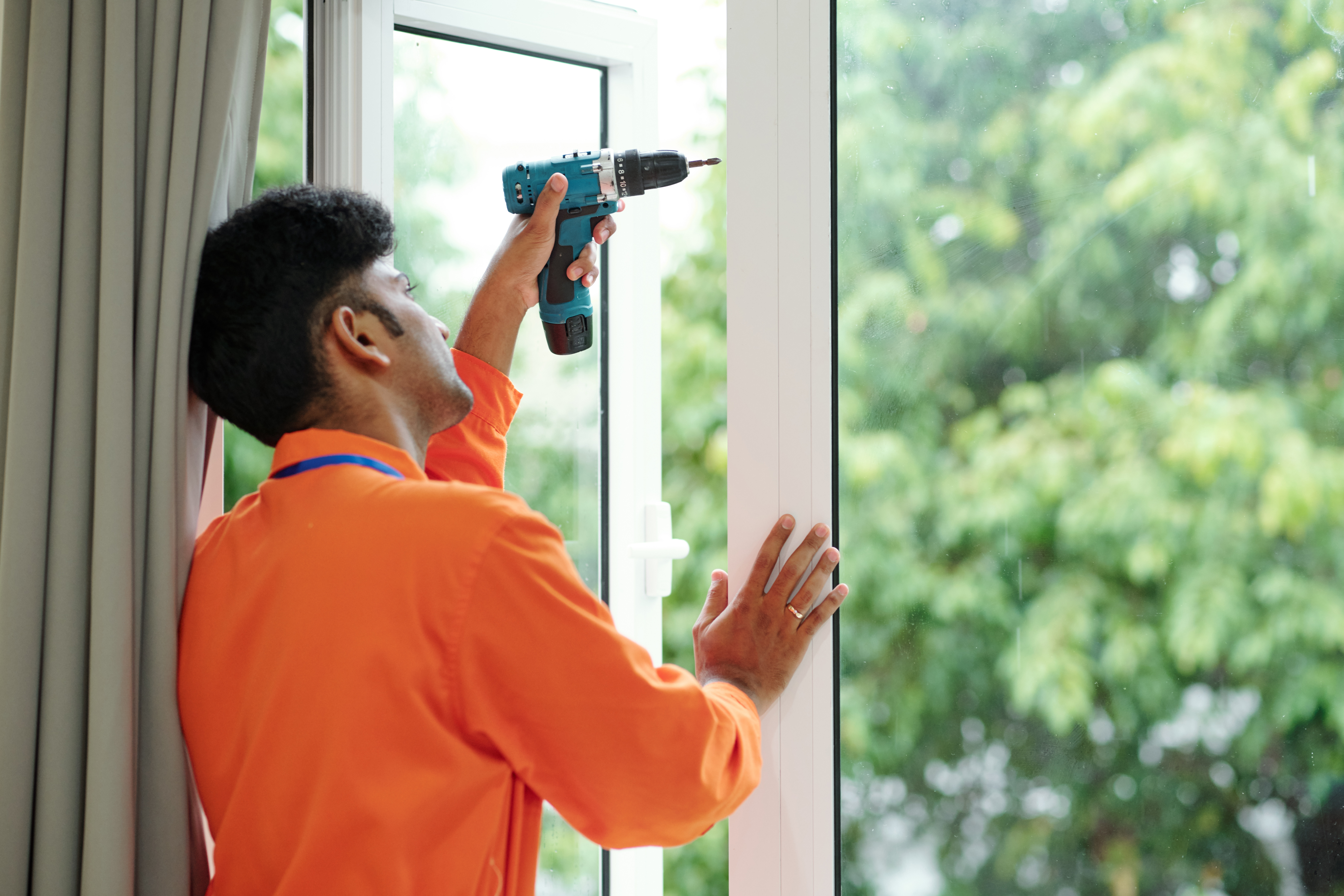 technician installing new windows