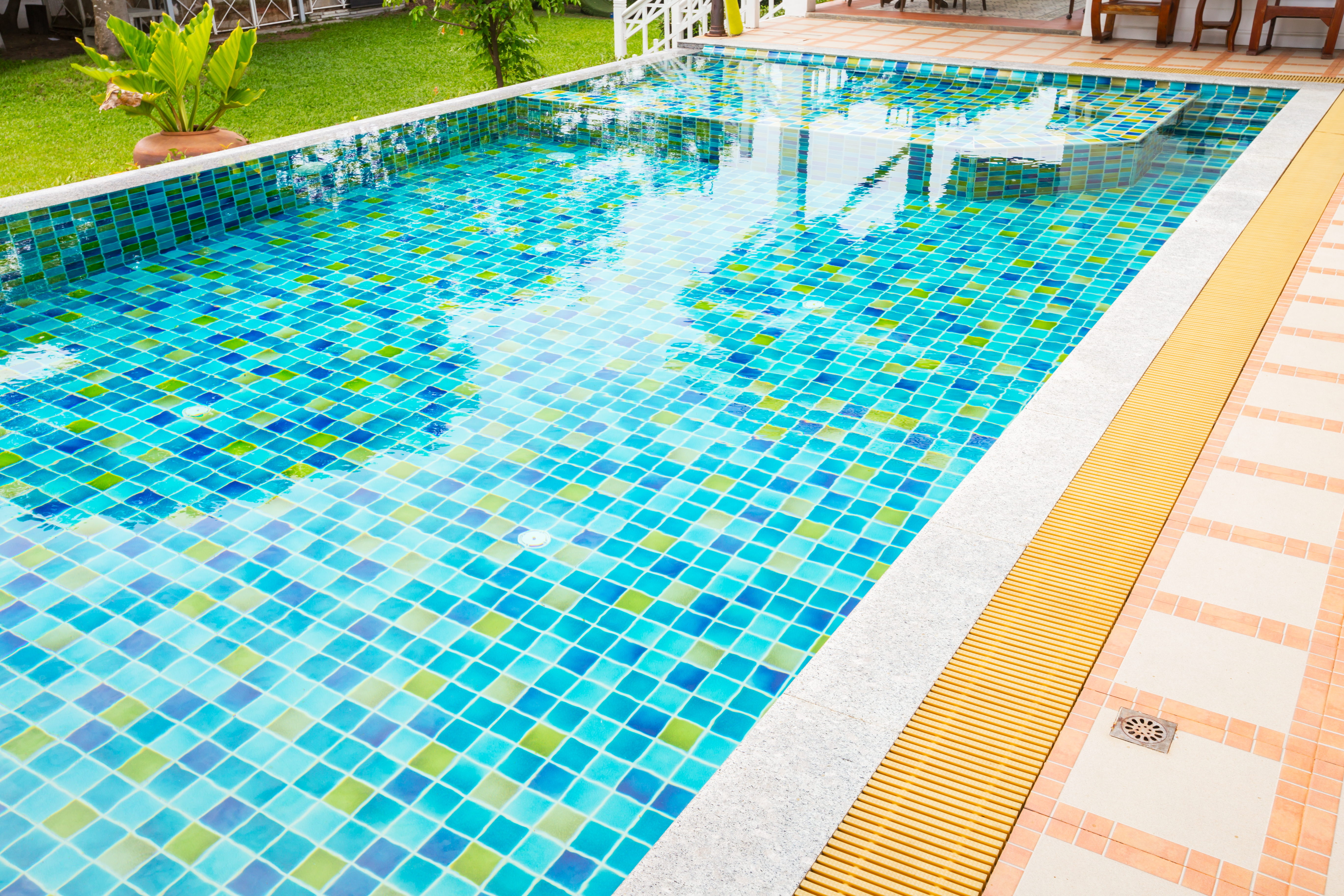 Rectangular backyard swimming pool with tile liner  