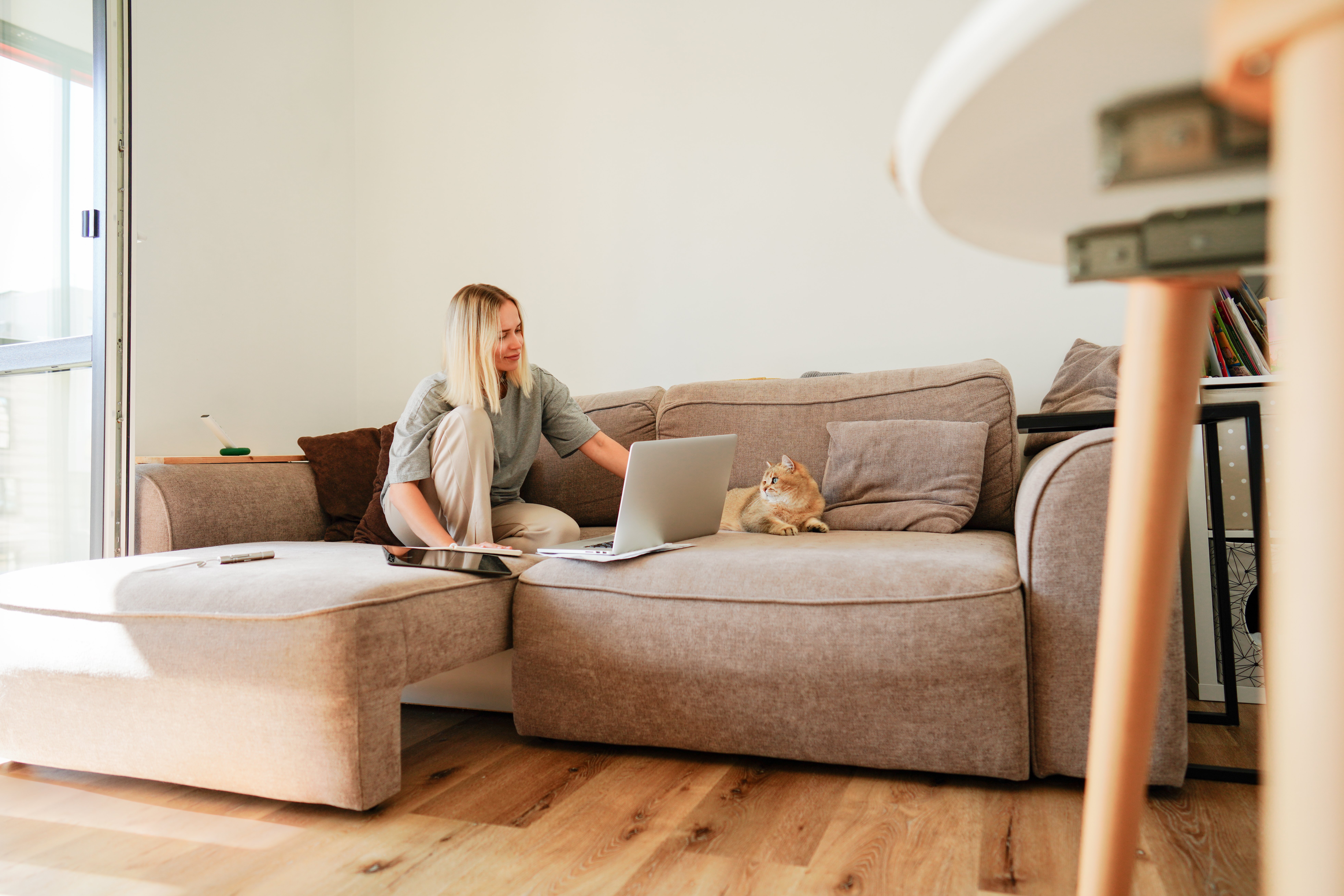Young woman working comfortable on couch