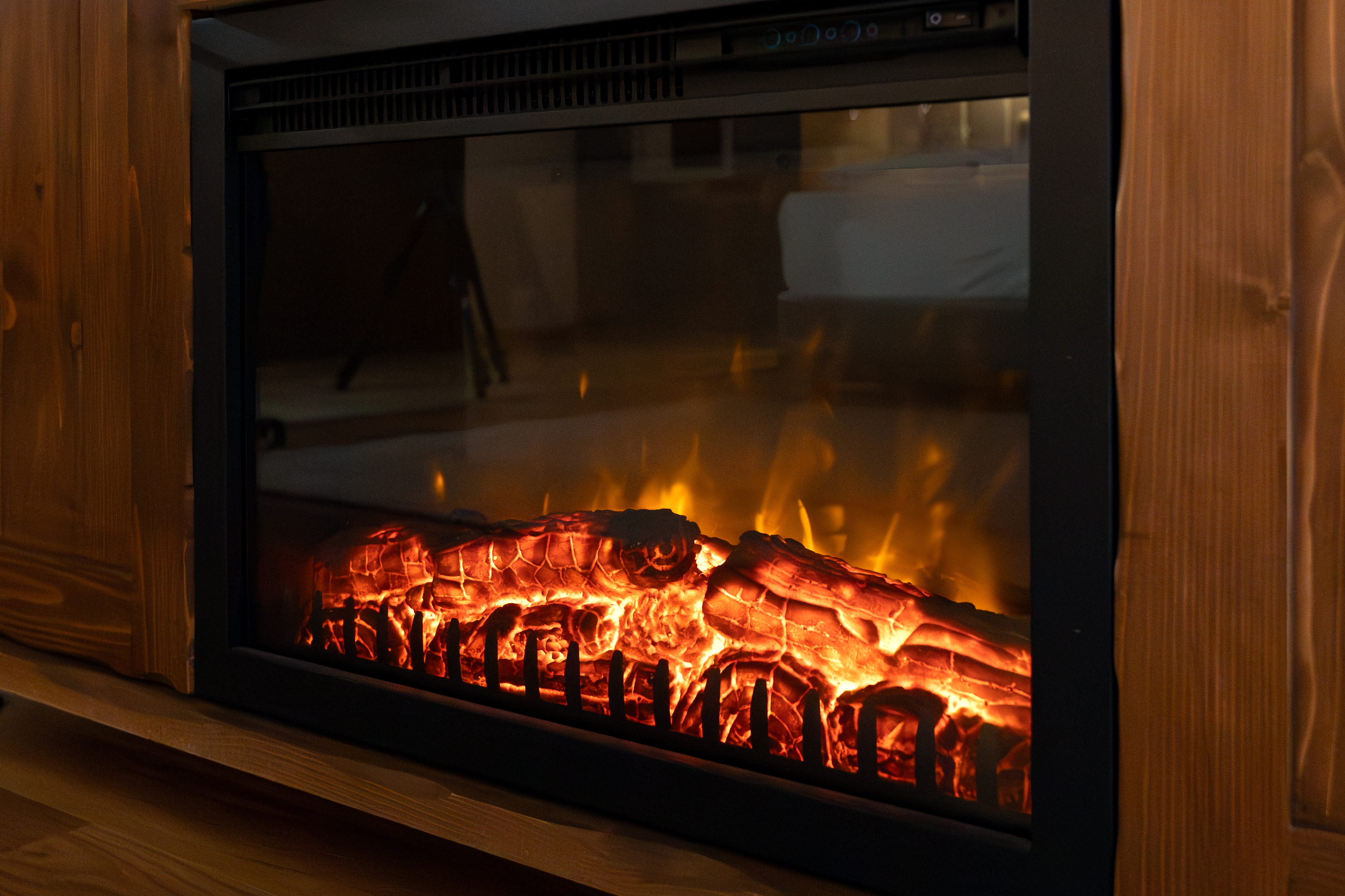 Electric fireplace burning firewood