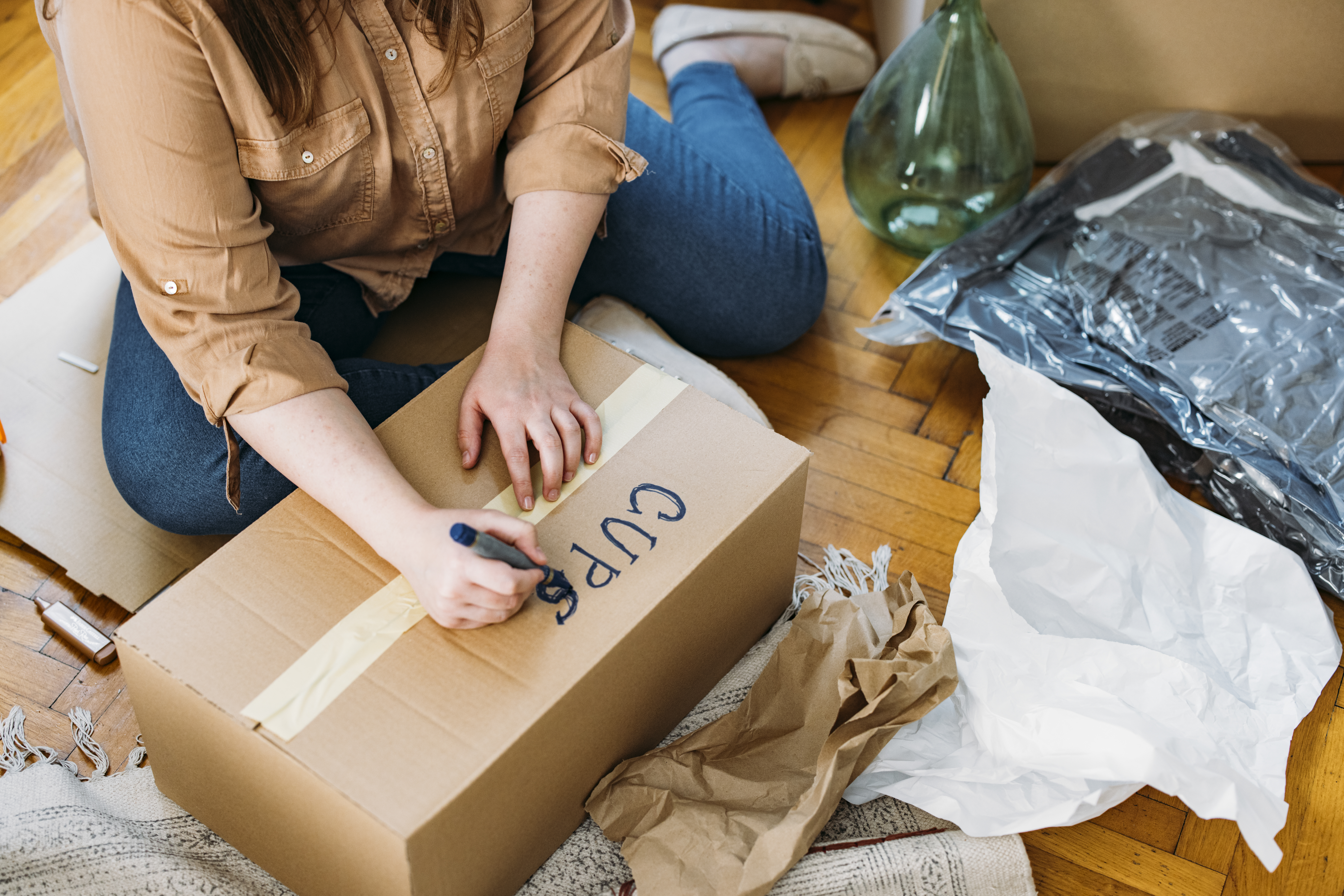 Woman labeling moving box