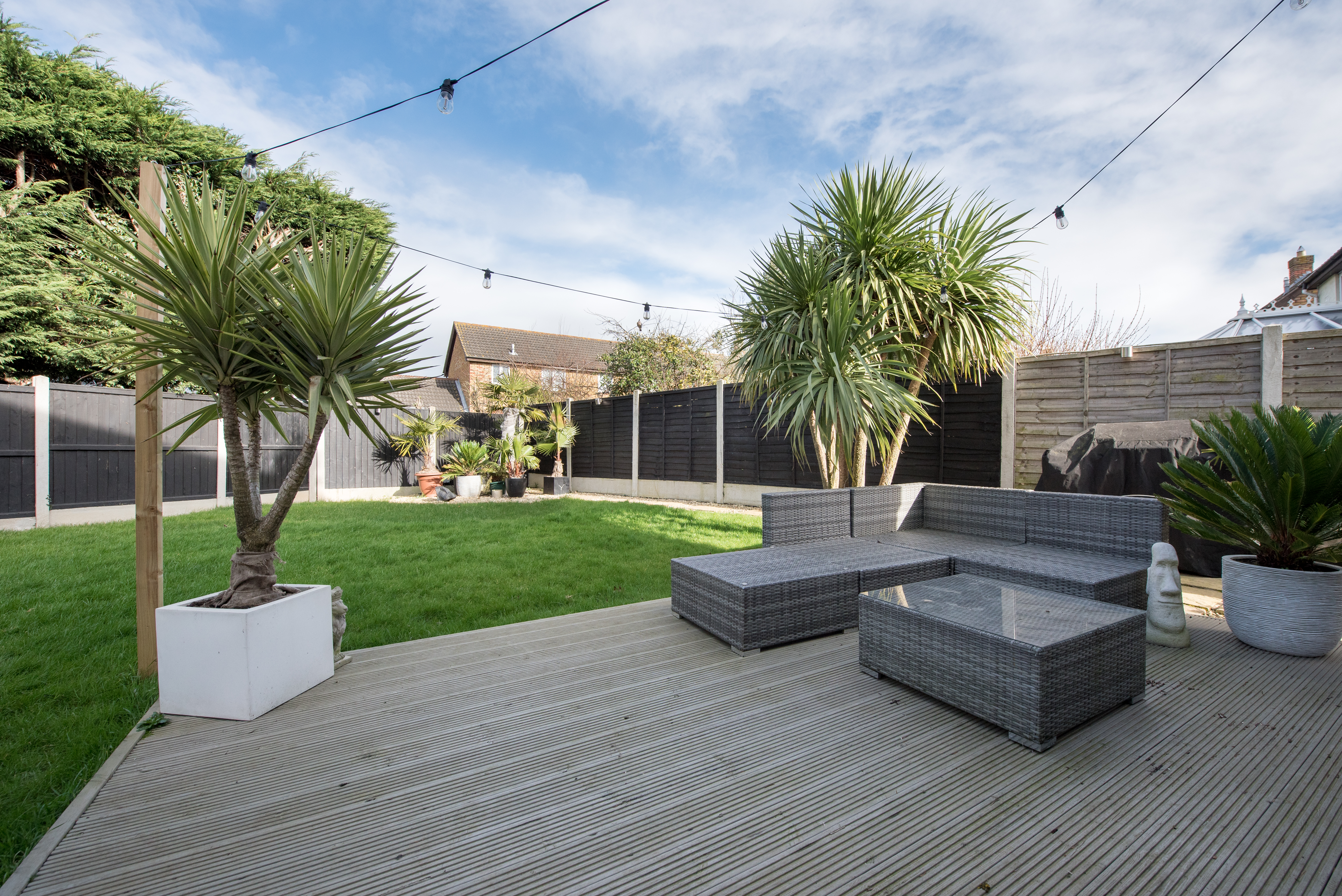 A deck as part of a large yard