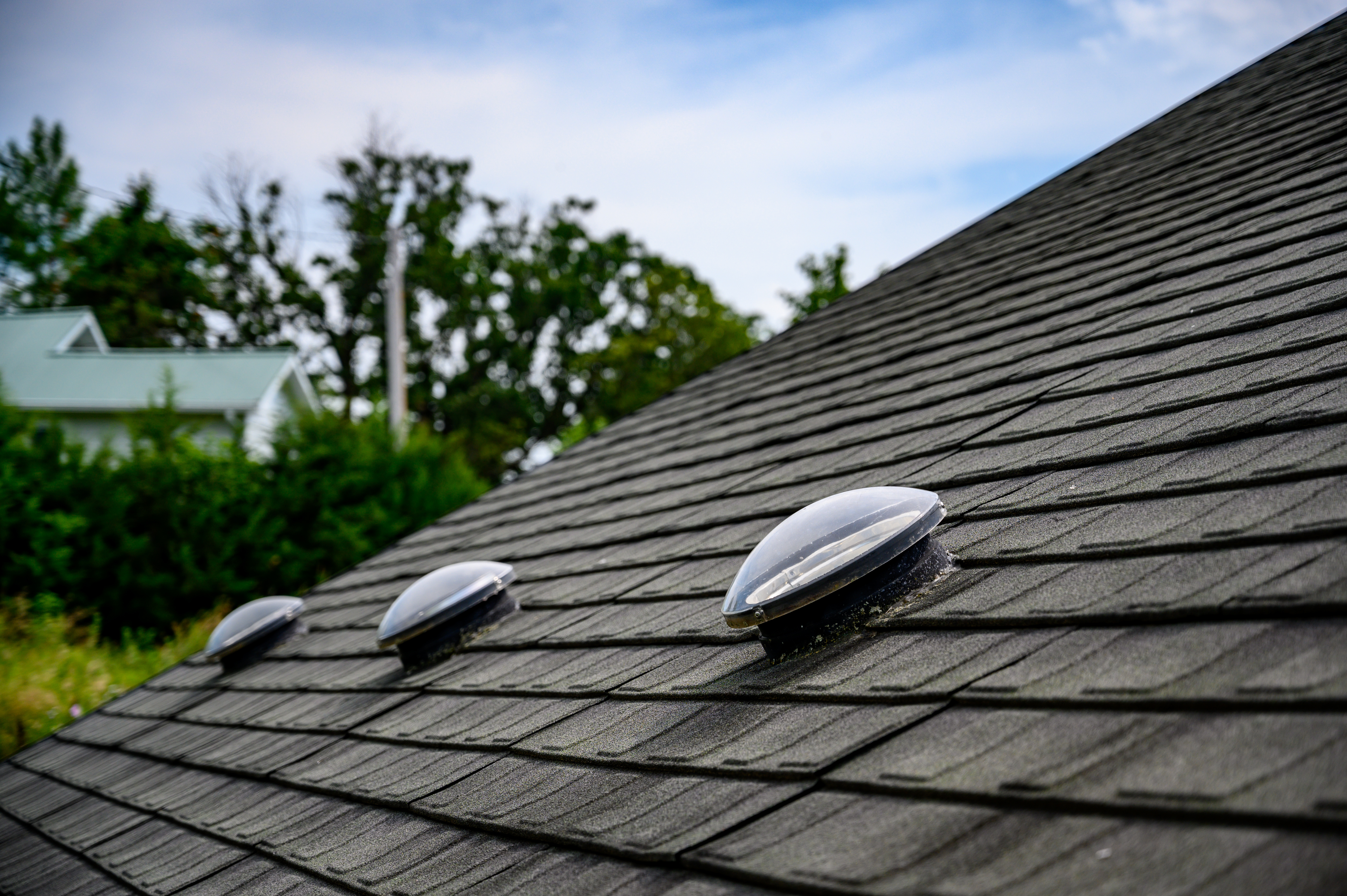 Solar tube skylight on asphalt shingle roof