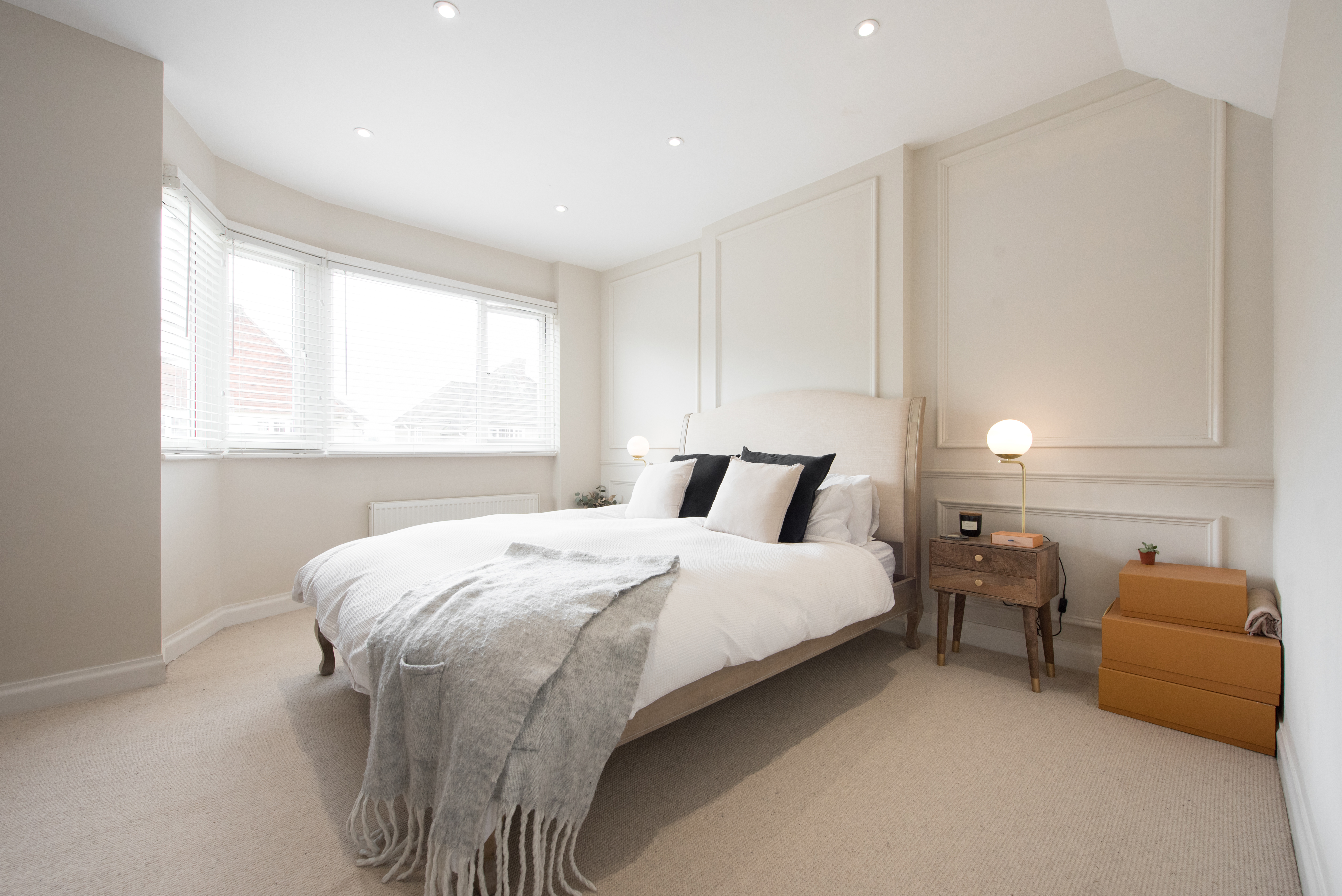 Modern bedroom with beige carpet