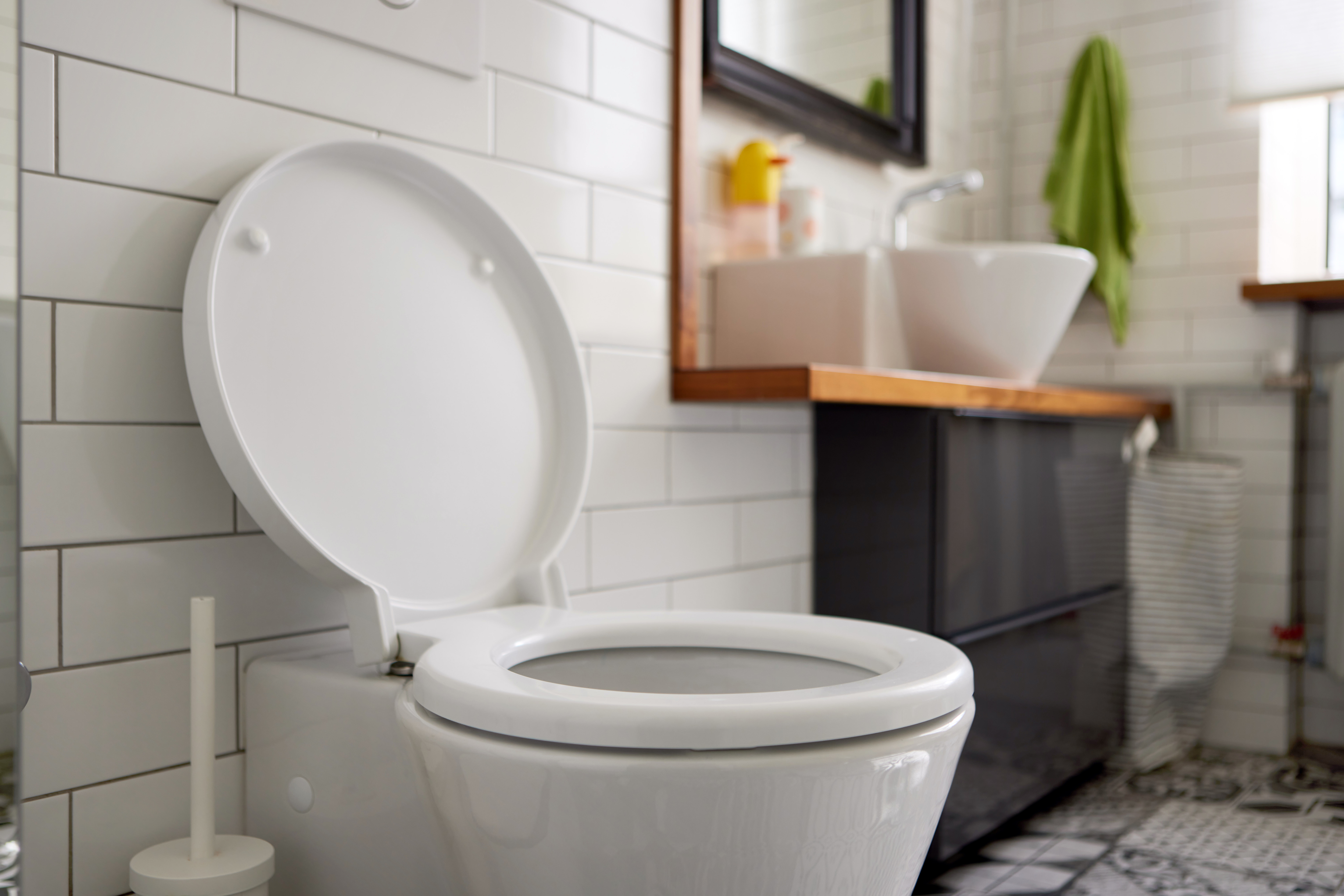 A toilet in a bathroom