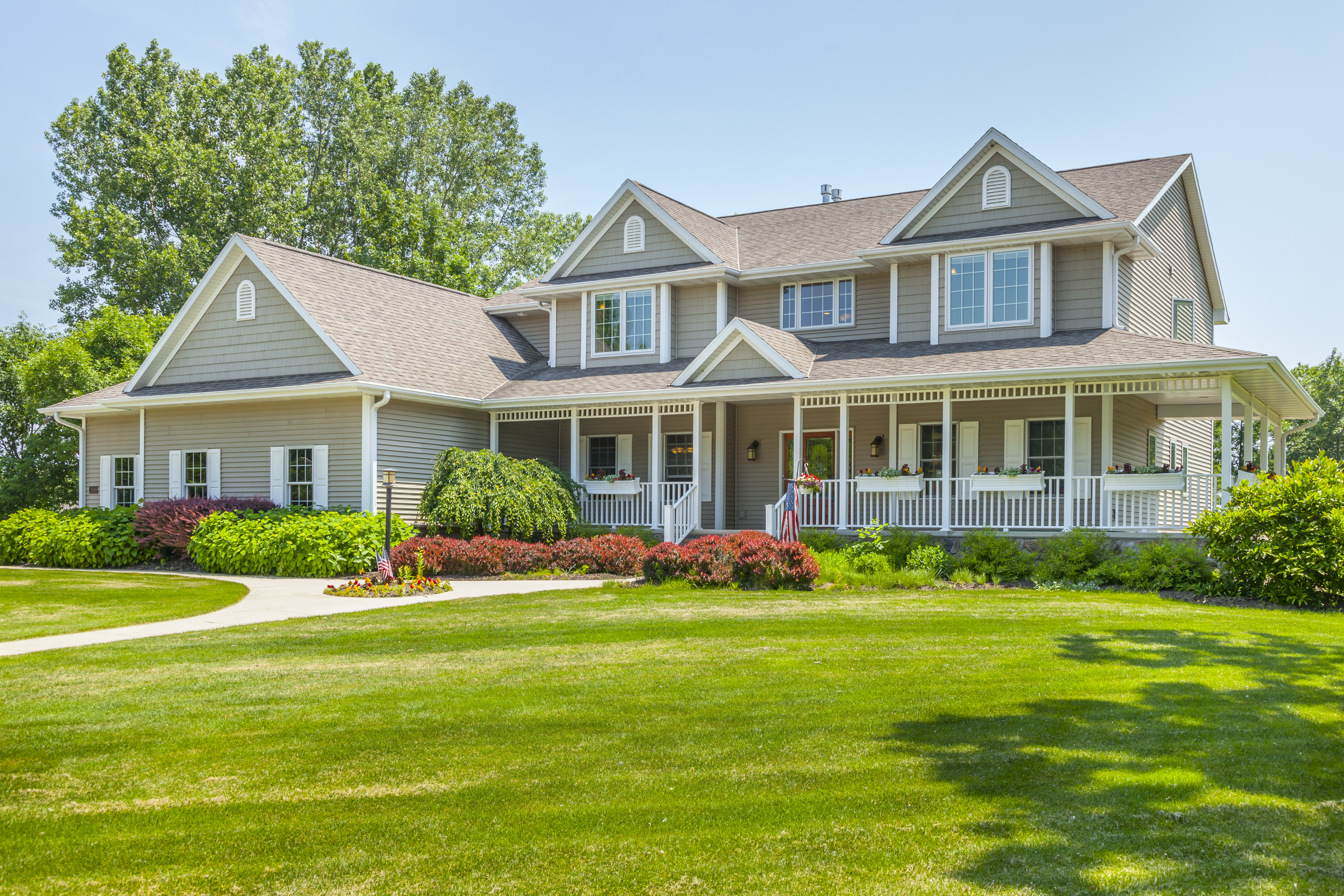 A house with a beautiful yard with lawn