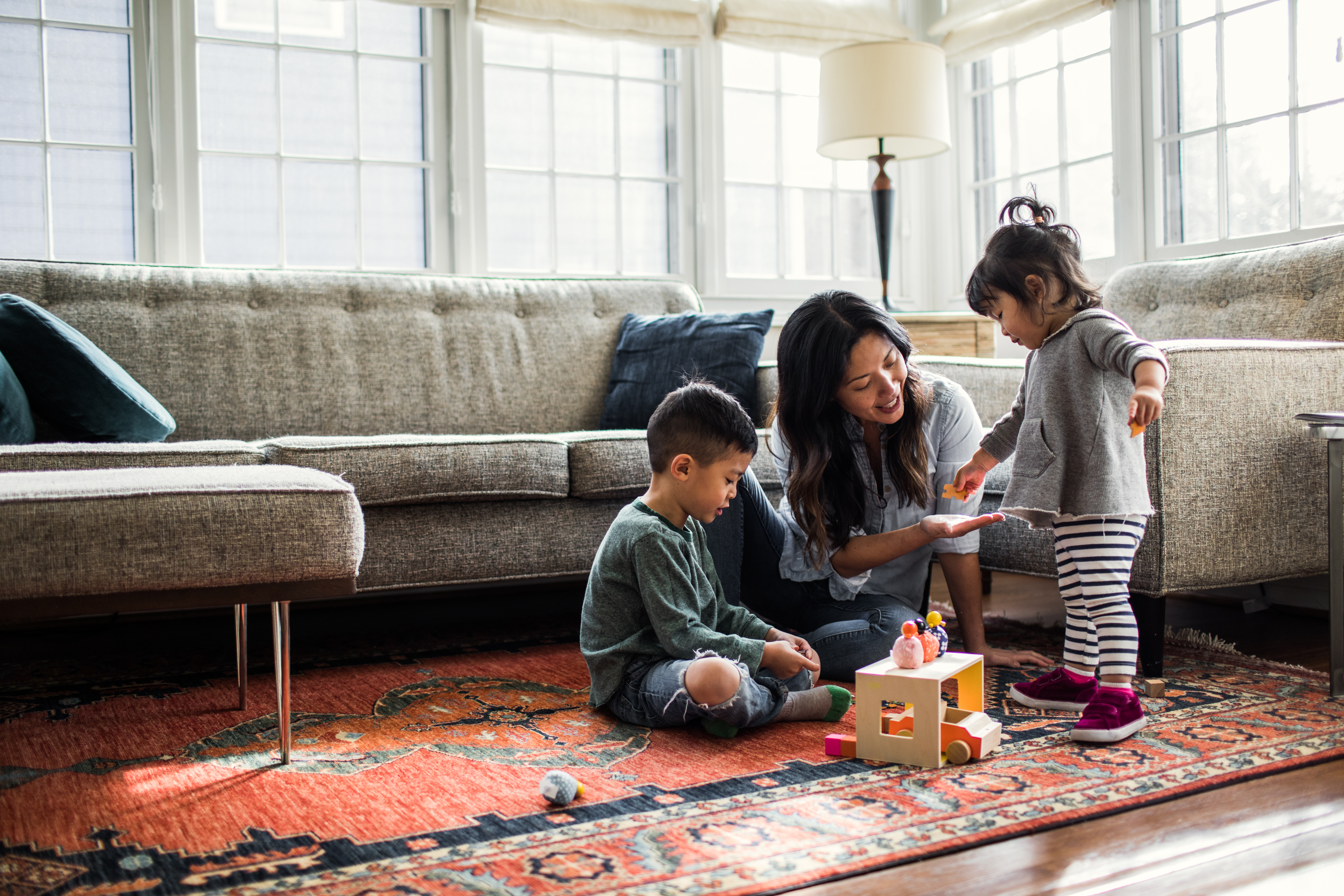 Mom playing with her kids at home