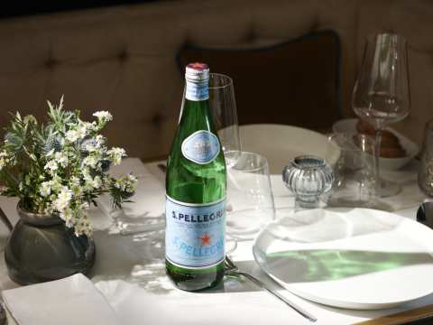S.Pellegrino bottle and dinner table