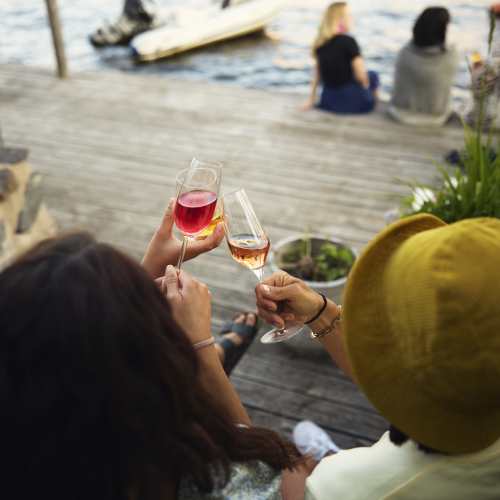 Anora brand image - drinks at the dock