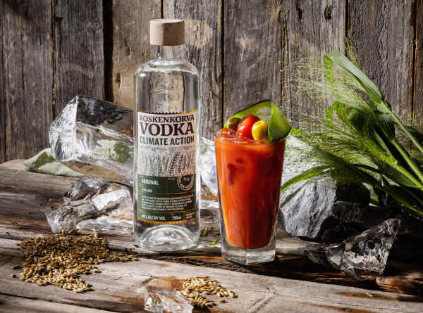 Koskenkorva vodka bottle and a Bloody Mary cocktail