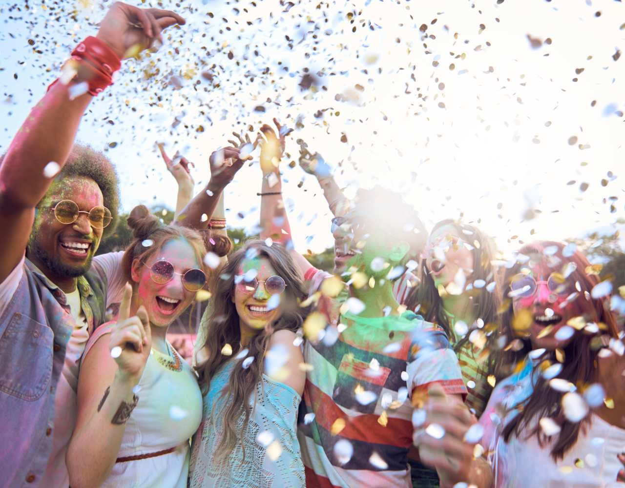 Young people celebrating in confetti rain