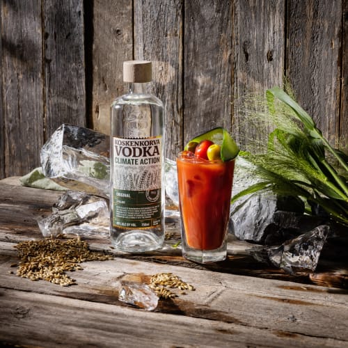 Koskenkorva vodka bottle and a Bloody Mary cocktail