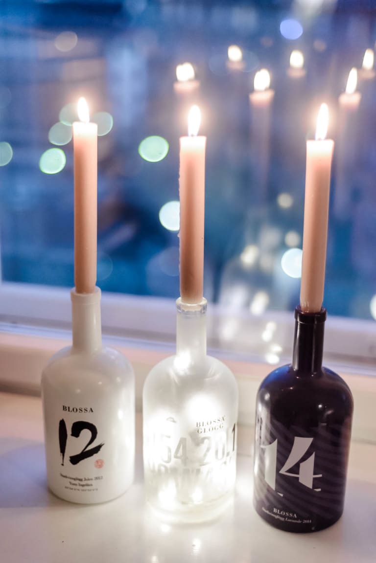 Annual Blossa bottles from 2012-2014 with candles