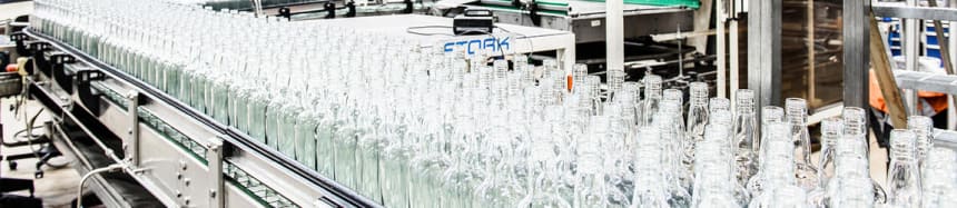 Bottles moving in lines at Rajamäki beverage factory