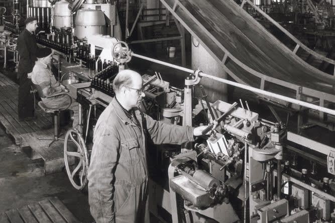 Black and white image of an old bottling line