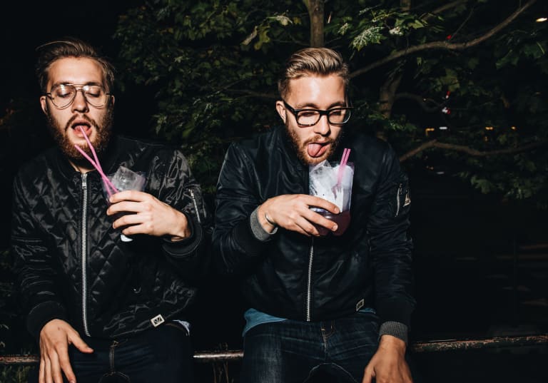 Men drinking cocktails at a party