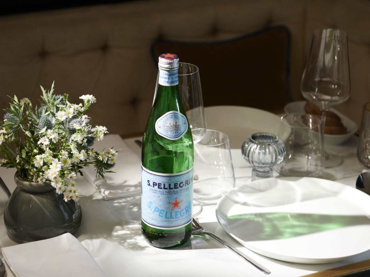 S.Pellegrino bottle and dinner table