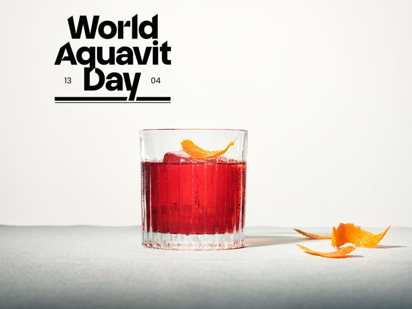 Akvavitdrink och logga för World Aquavit Day