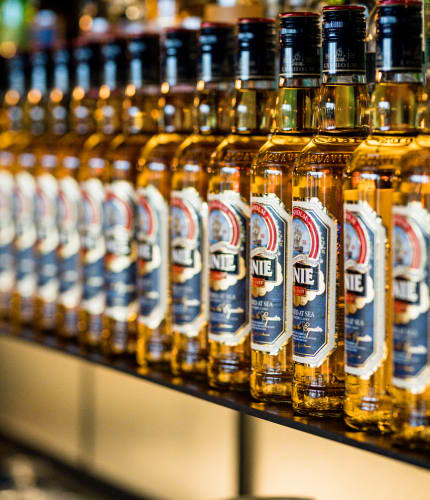 Linie Aquavit bottles on a shelf