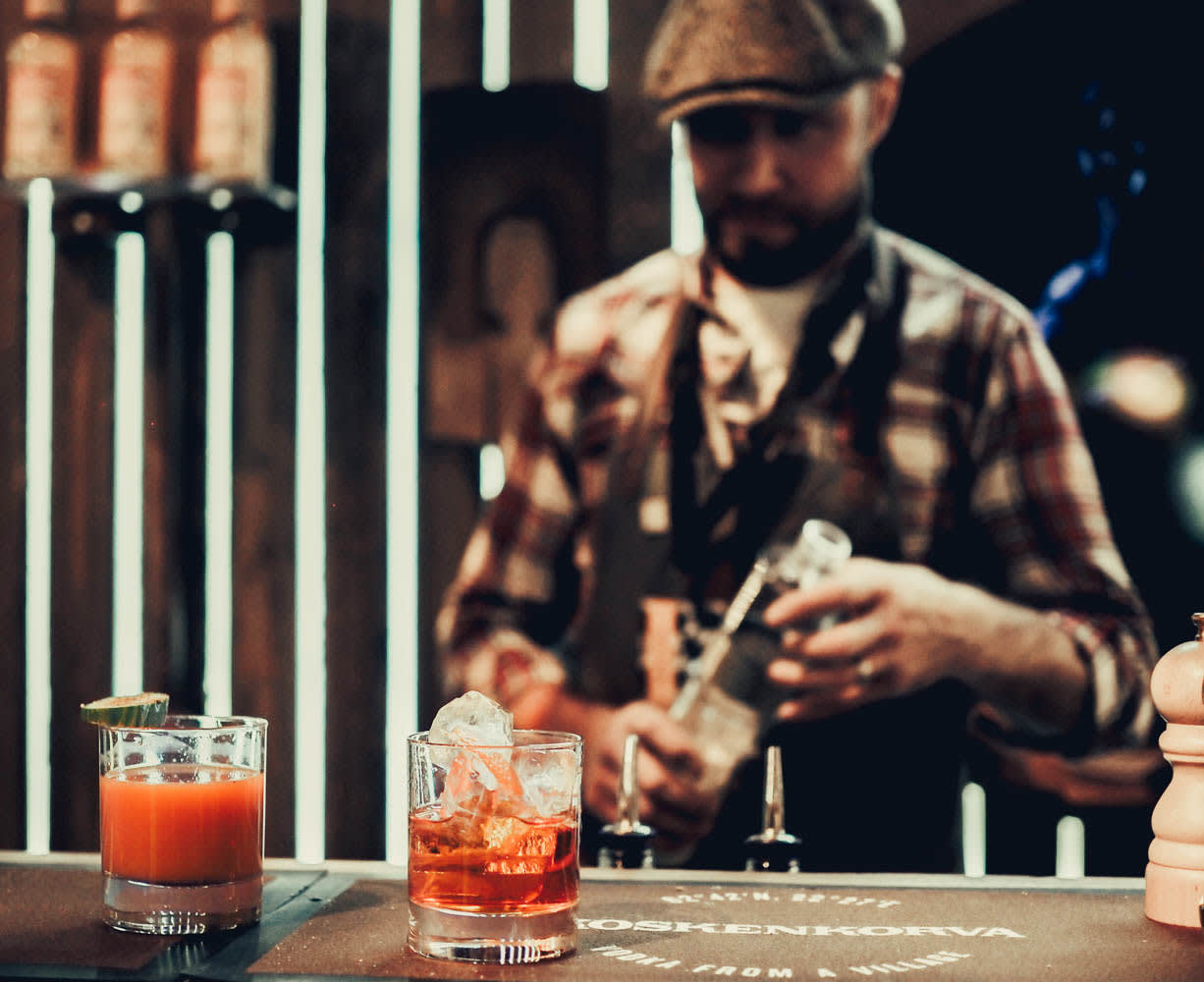 Two Koskenkorva cocktails with an old school bartender