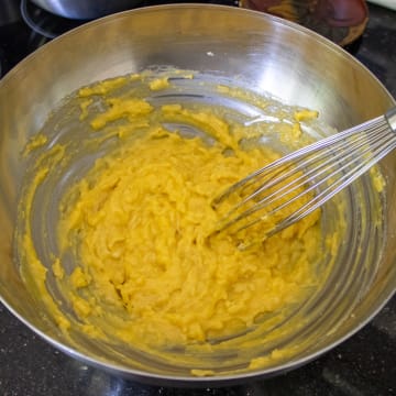 Stir in Cheese and Egg Yolks