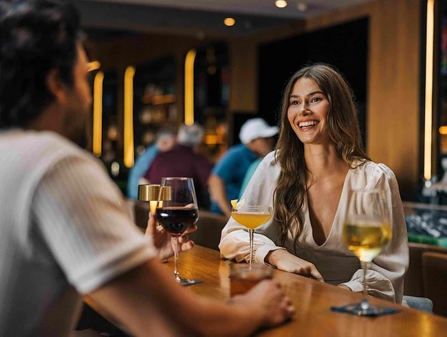 Sommelier pouring wine for guests