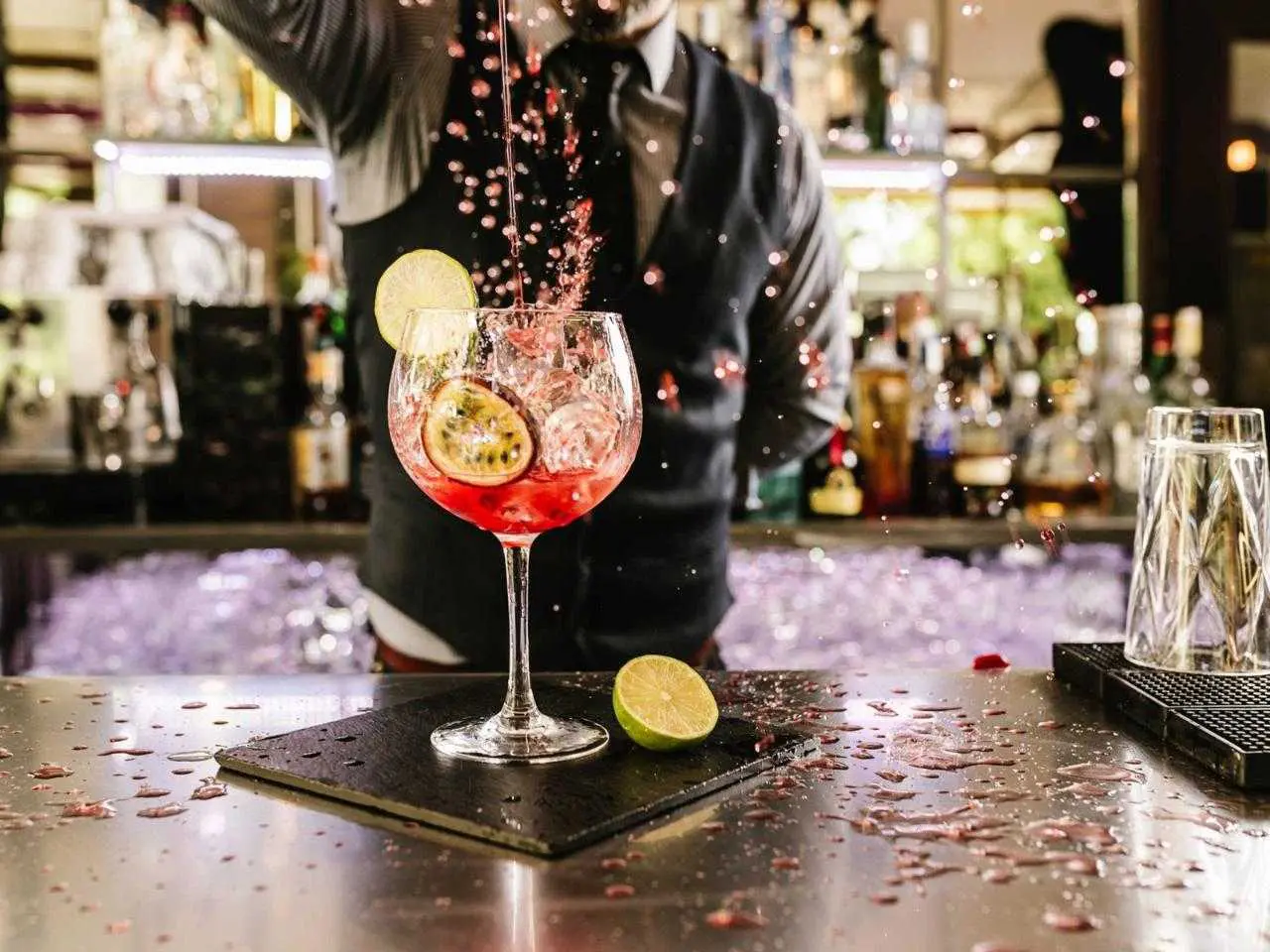 Mixologist demonstrating cocktail techniques