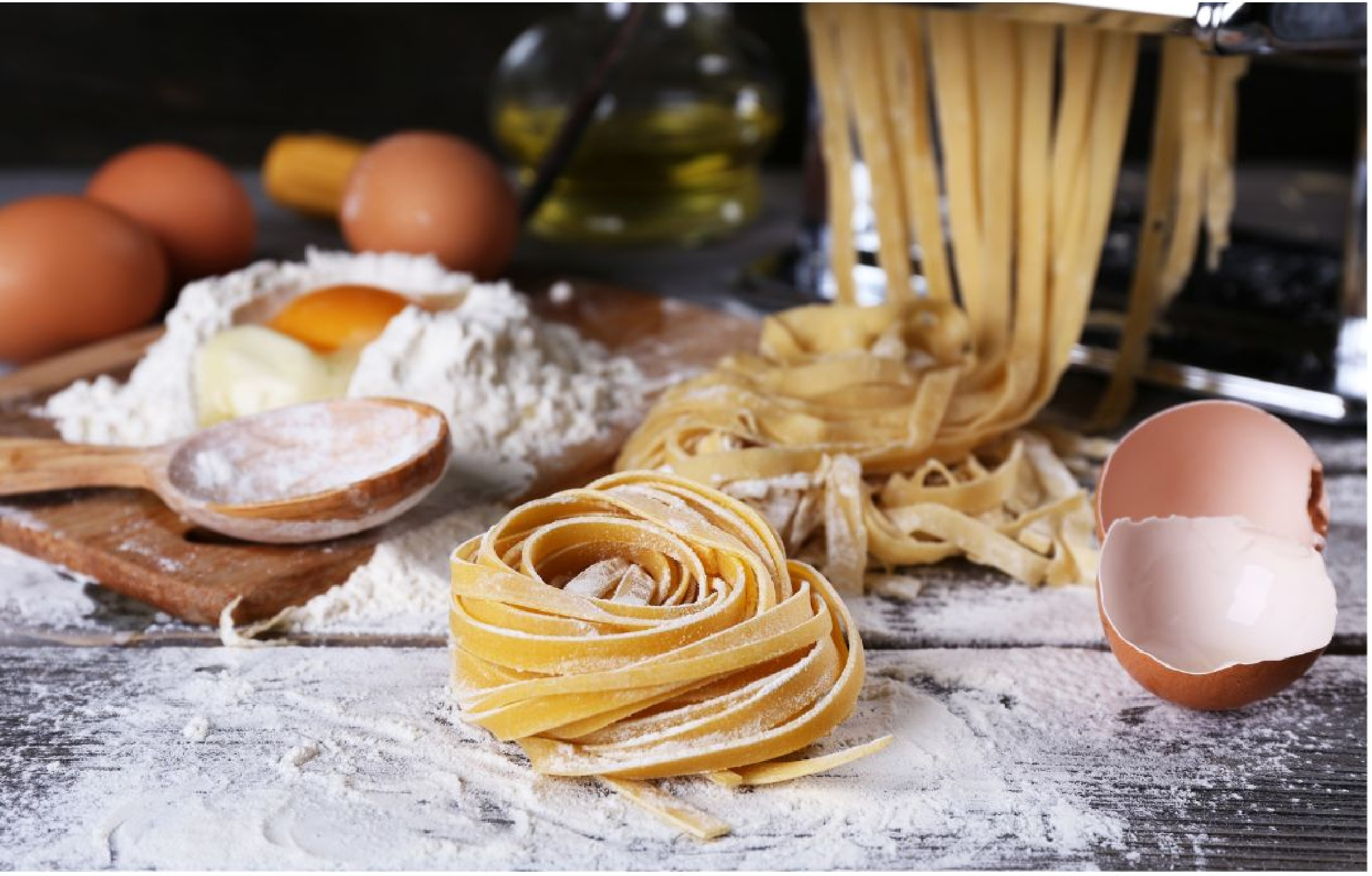 Hands making fresh pasta