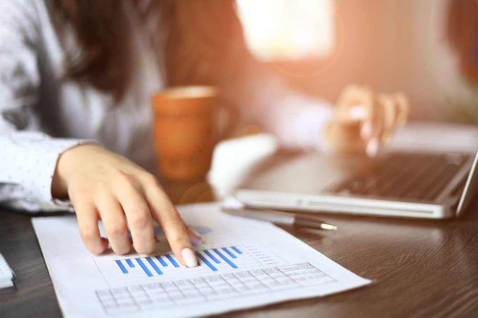 Hands of financial manager taking notes when working - rent reduction