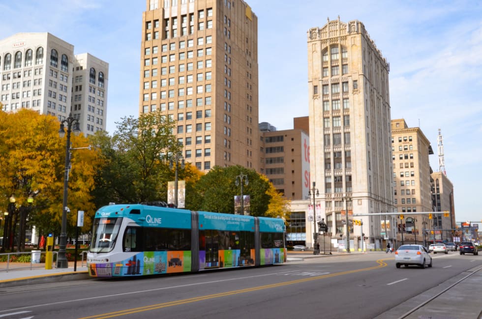 Detroit’s QLine, shown here, runs along Woodward Avenue in downtown Detroit.