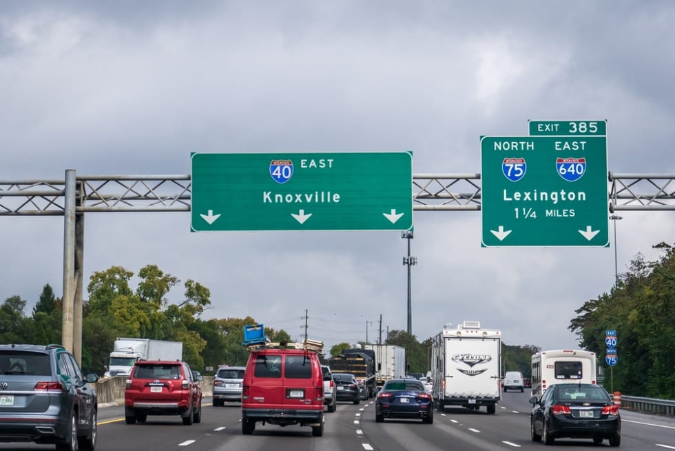 Signs on Interstate 40 toward Knoxville and Exit 385 for I-75 North and I-640 East toward Lexington, Kentucky.