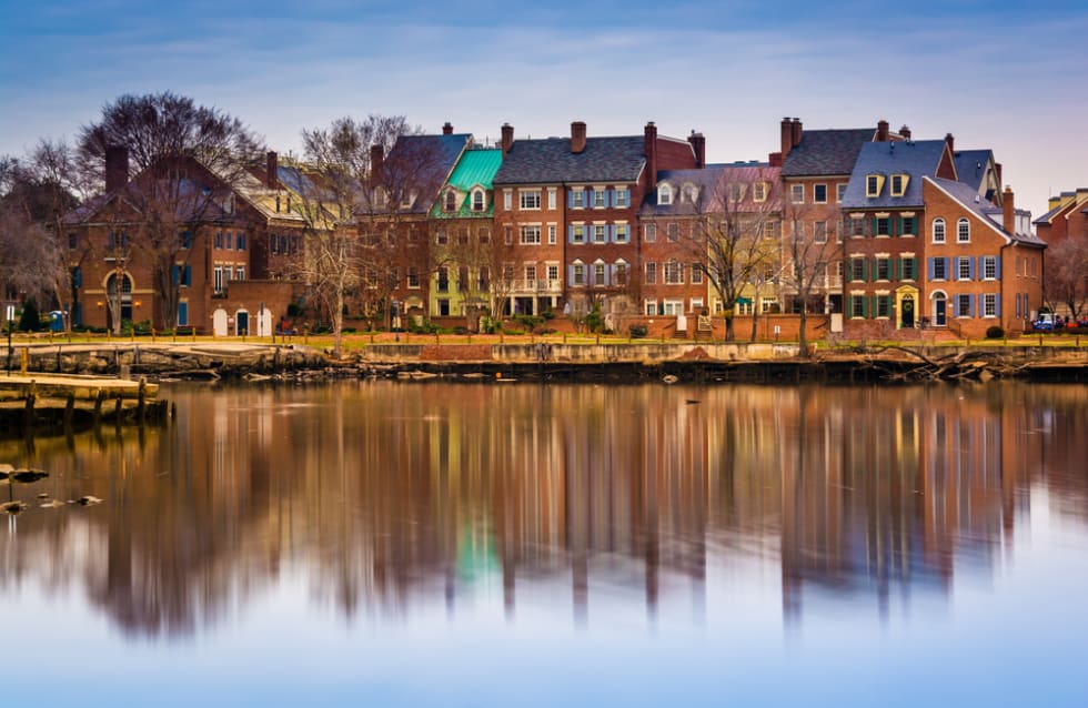  Reflections of waterfront buildings along the Potomac River in Alexandria, Virginia.