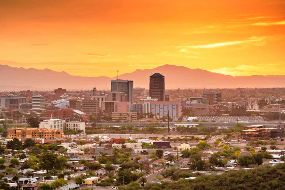 Tucson, Arizona, USA downtown skyline with Sentinel Peak at dusk