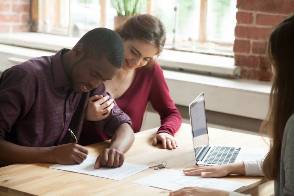 Couple Signing Lease Agreement