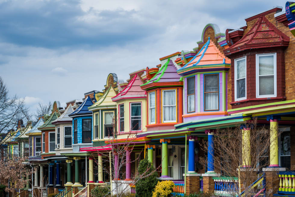  Colorful row houses along Guilford Avenue in Charles Village, Baltimore, Maryland.