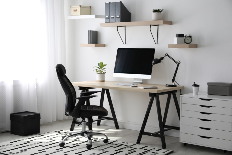 Workspace computer and office supplies on office workplace.