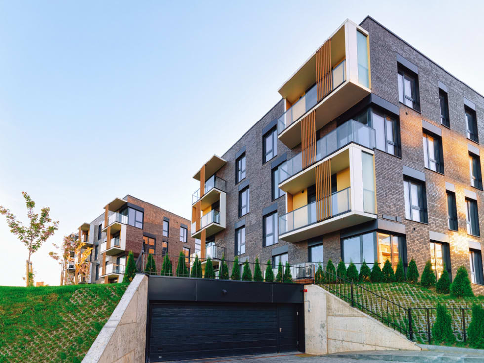  Modern residential home apartment building architecture with garage. 