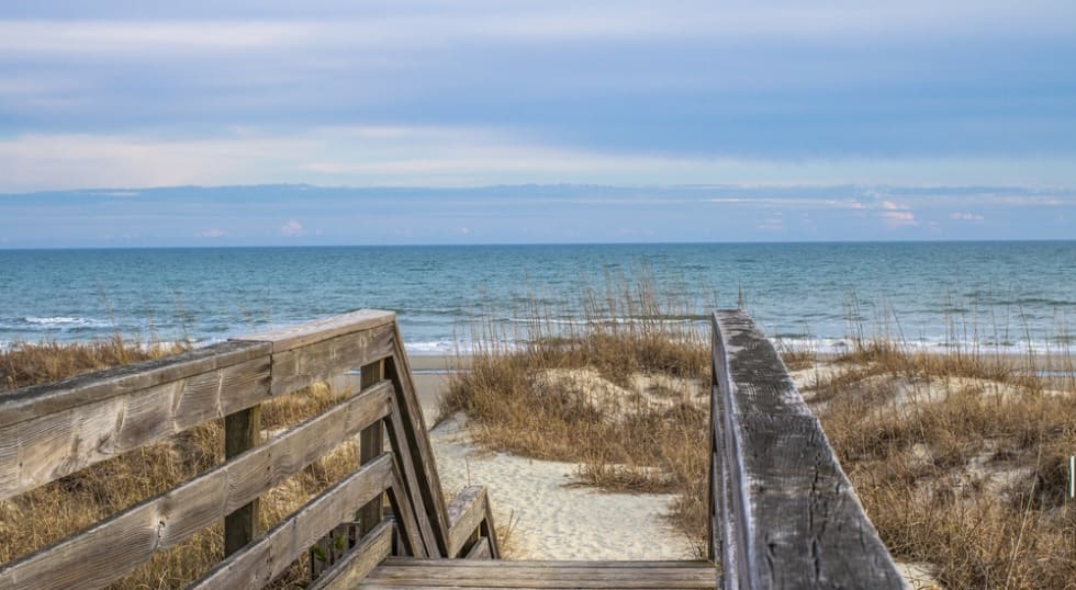 Stairs To The Beach. Wooden stairway leads to the wide sandy beaches of South Carolina's Grand Strand. Myrtle Beach, South Carolina