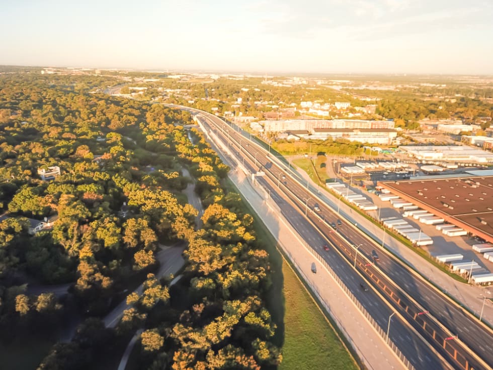 Top view industrial area near Kessler area located just south of downtown Dallas. Aerial view warehouse building next to nature Kessler Park