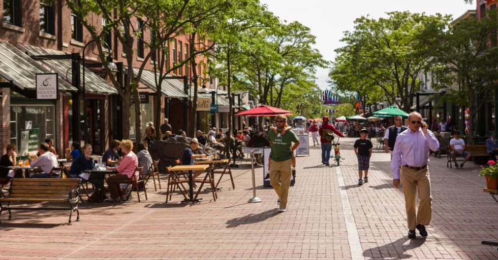 People on Church Street, a pedestrian mall with sidewalk cafes and restaurants