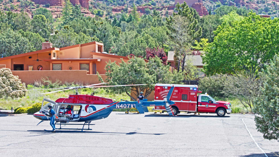 helicopter prepares to medivac the victim of a road traffic accident to hospital while a Sedona ambulance is present to assist