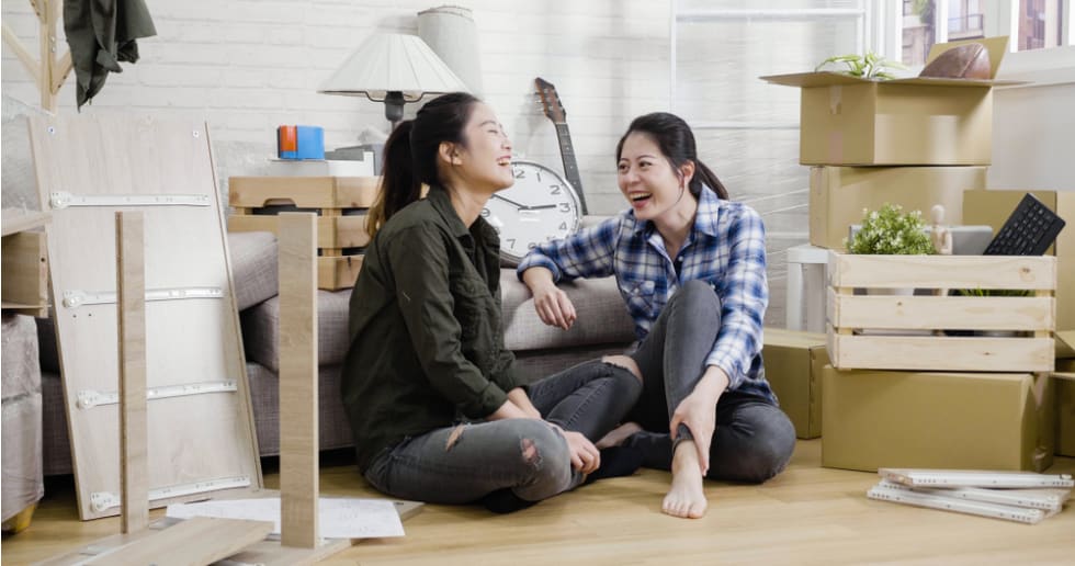 Two roommates laughing