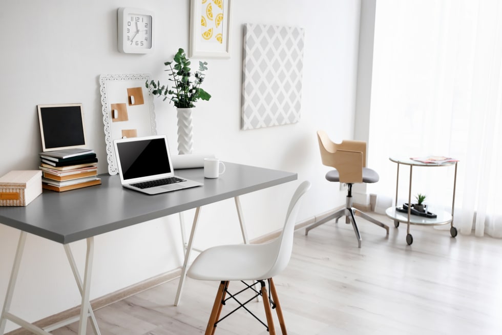 Comfortable workplace with laptop in office