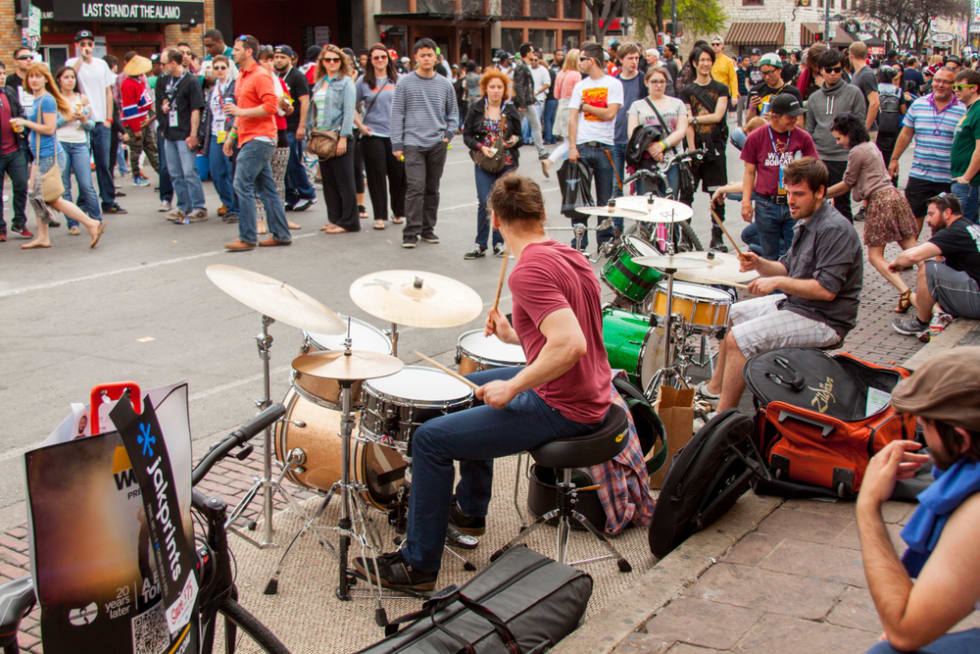  During the annual music festival musicians set up to play on Sixth St in Austin