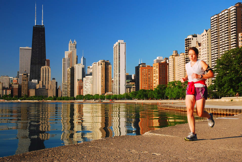 A jogger runs along a lakefront trail in Chicago, Illinois